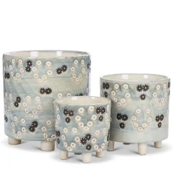 Cache-pot sur pieds à fleurs